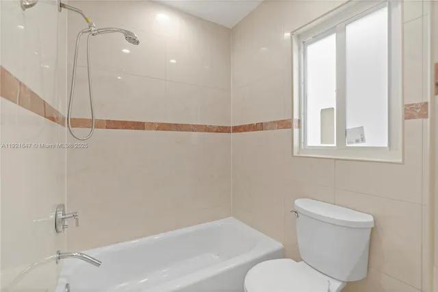 a view of walk in closet with wooden floor