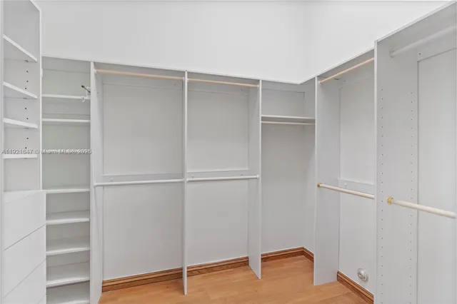 a bathroom with a tub a sink and a mirror