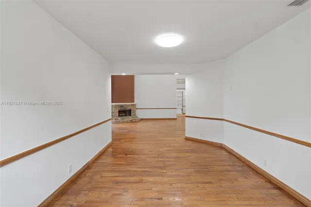 a front view of a house with a yard table and chairs