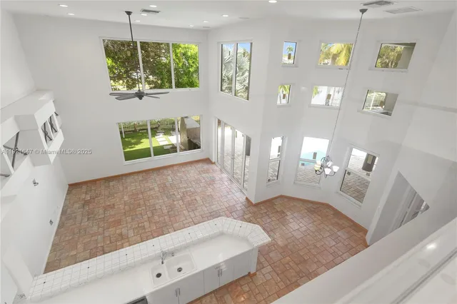 a view of a yard with a house in the background