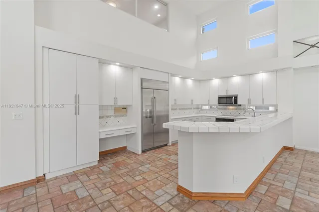 a house with palm tree in front of it