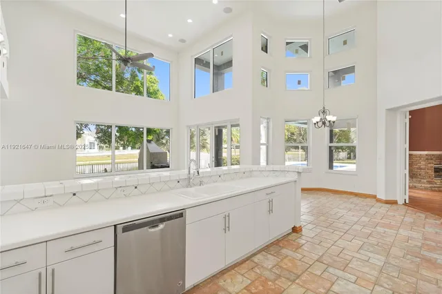 an aerial view of house with yard swimming pool and outdoor seating
