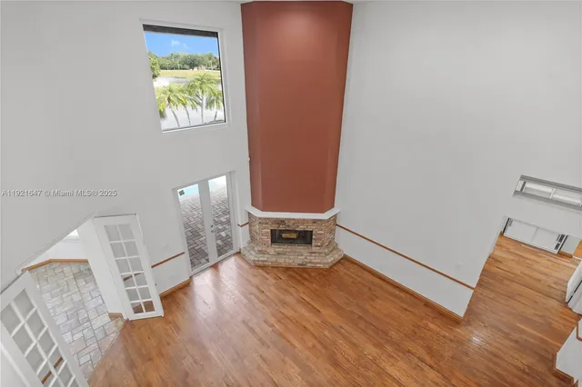 a view of a hallway with stairs