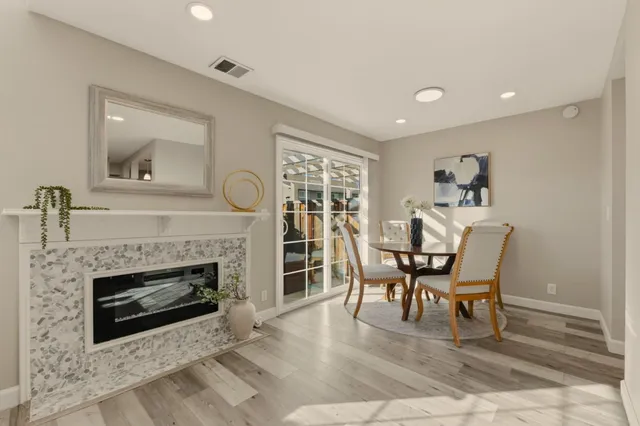 a view of a dining room with furniture and a kitchen