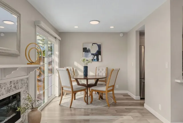 a kitchen with granite countertop a sink cabinets and stainless steel appliances