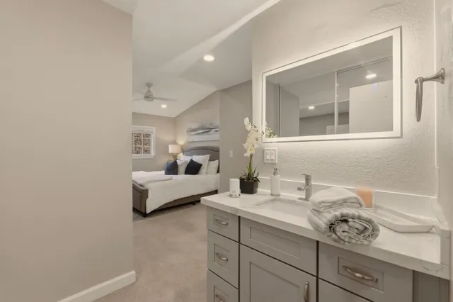 a bathroom with a sink and mirror