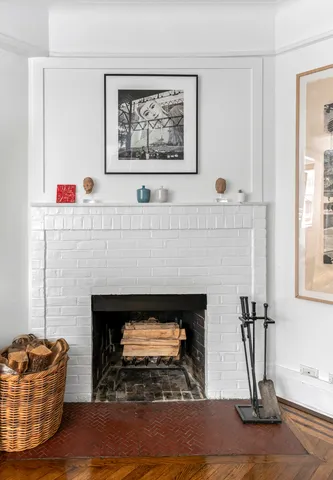 a living room with furniture and a book shelf