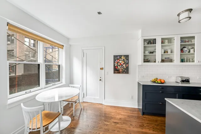 a kitchen with stainless steel appliances granite countertop a sink and a stove
