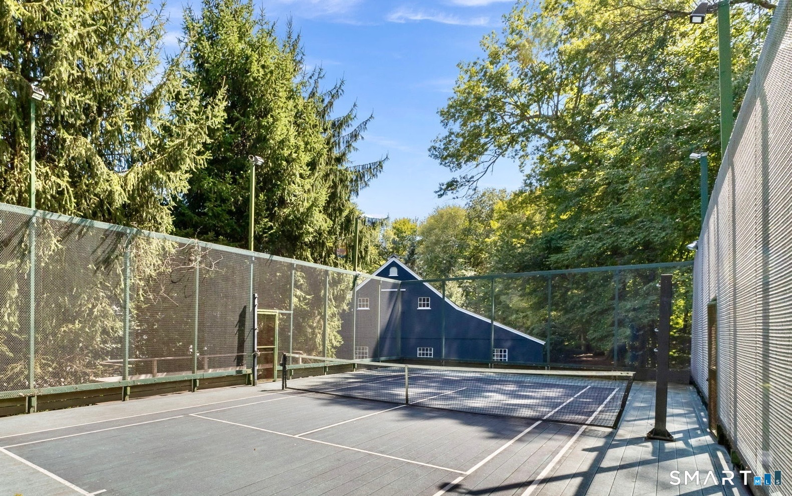 245 Benedict Hill Road New Canaan, CT 06840 - Photo 14 of 49 a backyard of a house with lots of green space