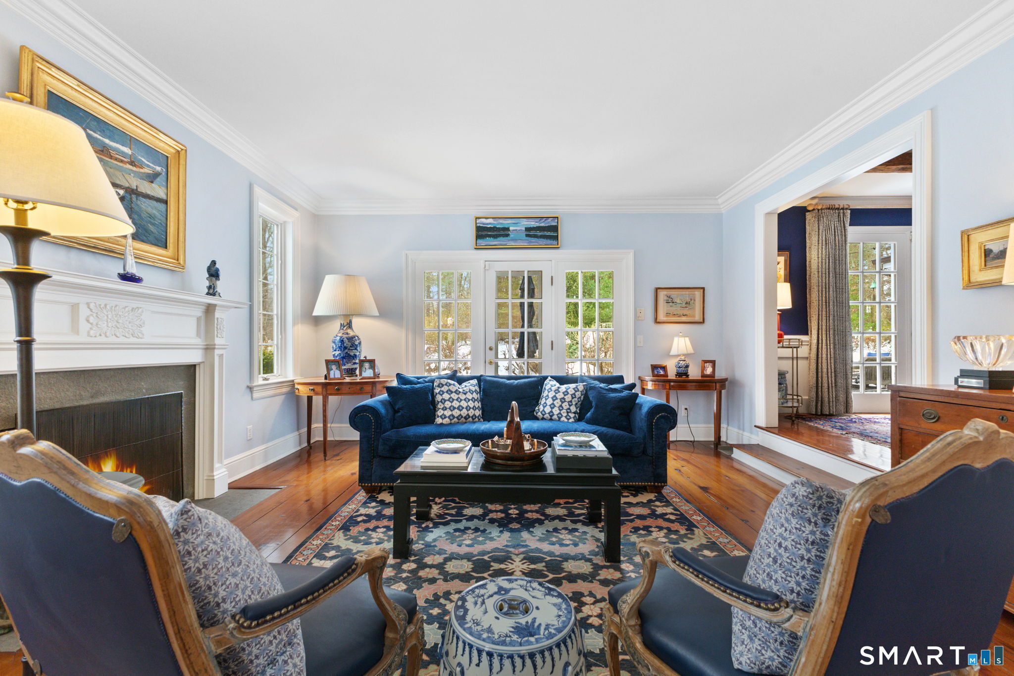 245 Benedict Hill Road New Canaan, CT 06840 - Photo 15 of 49 a living room with furniture fireplace and a large window