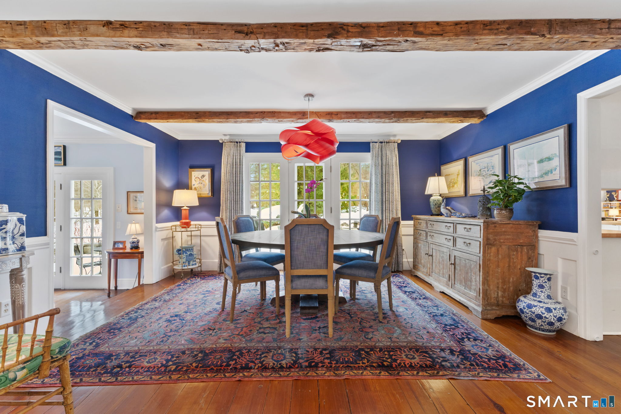 245 Benedict Hill Road New Canaan, CT 06840 - Photo 17 of 49 a dining room with furniture a rug and wooden floor