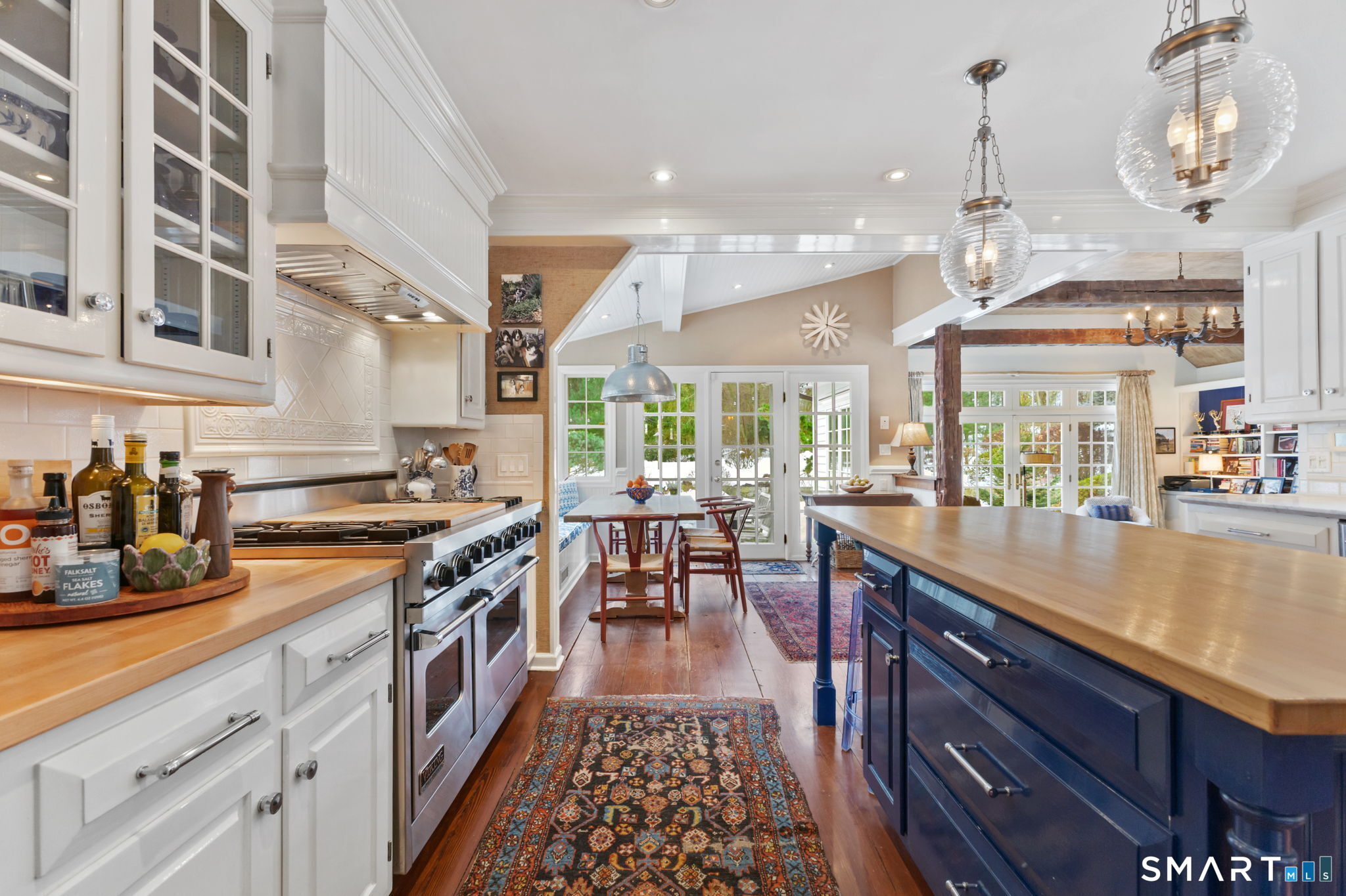 245 Benedict Hill Road New Canaan, CT 06840 - Photo 20 of 49 a kitchen with stainless steel appliances granite countertop a stove and more cabinets