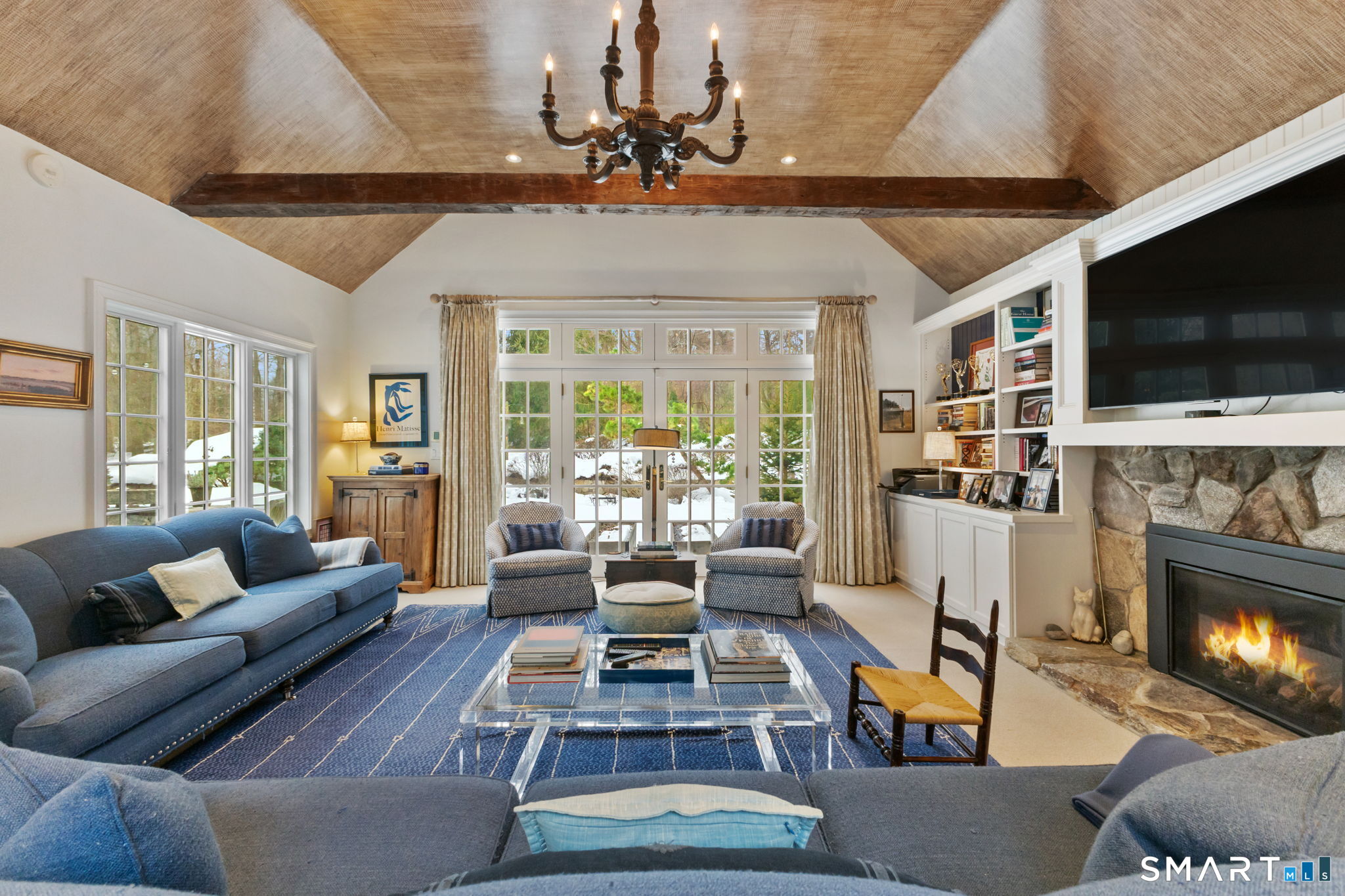 245 Benedict Hill Road New Canaan, CT 06840 - Photo 23 of 49 a living room with fireplace furniture and a flat screen tv