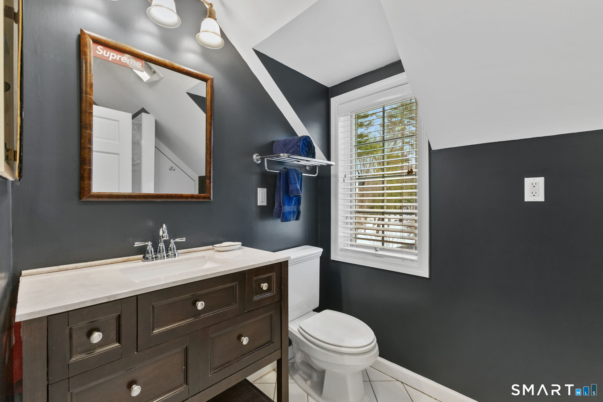 245 Benedict Hill Road New Canaan, CT 06840 - Photo 29 of 49 a bathroom with a toilet sink vanity granite and mirror