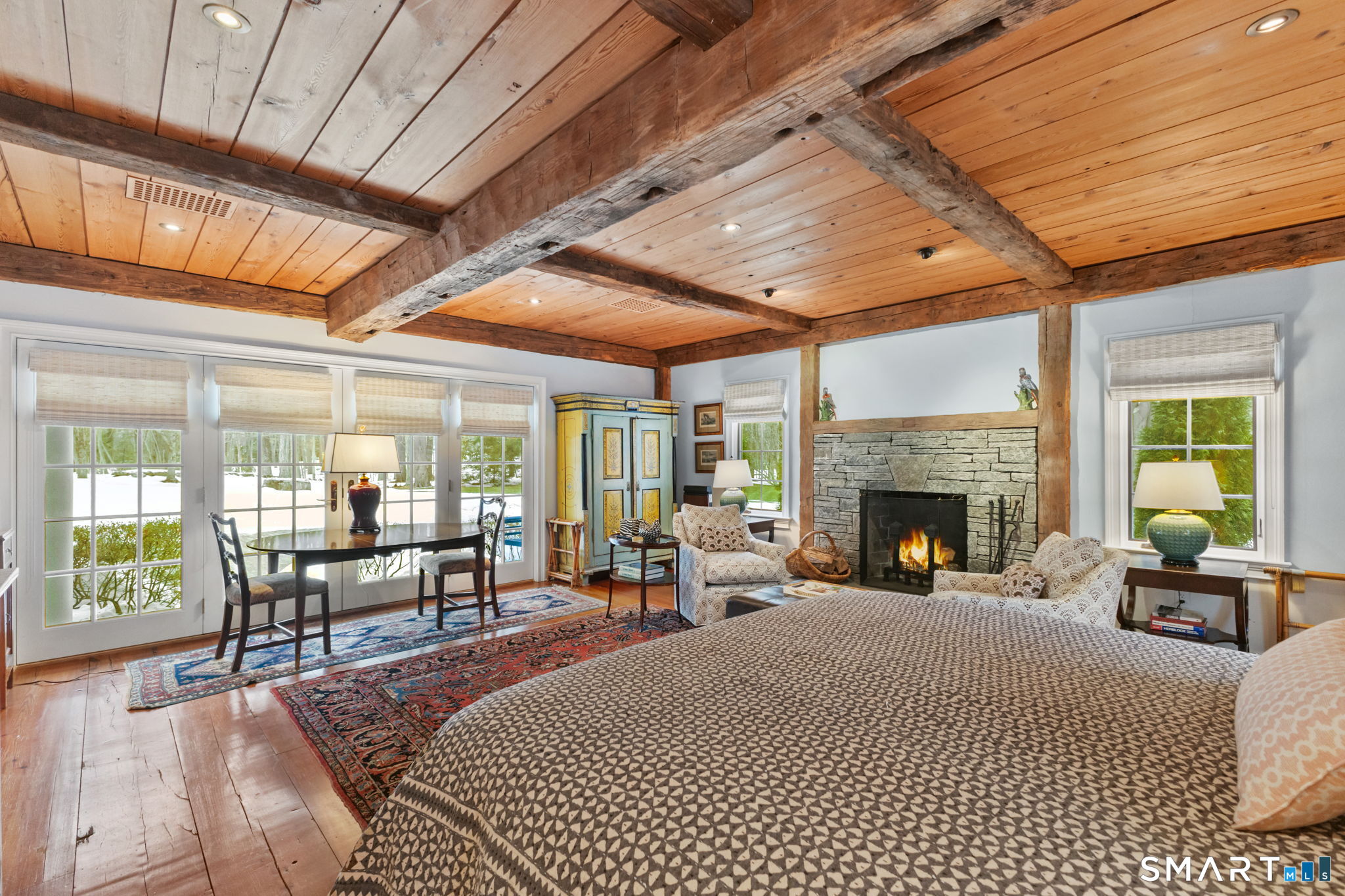 245 Benedict Hill Road New Canaan, CT 06840 - Photo 31 of 49 a living room with furniture large windows and a fireplace