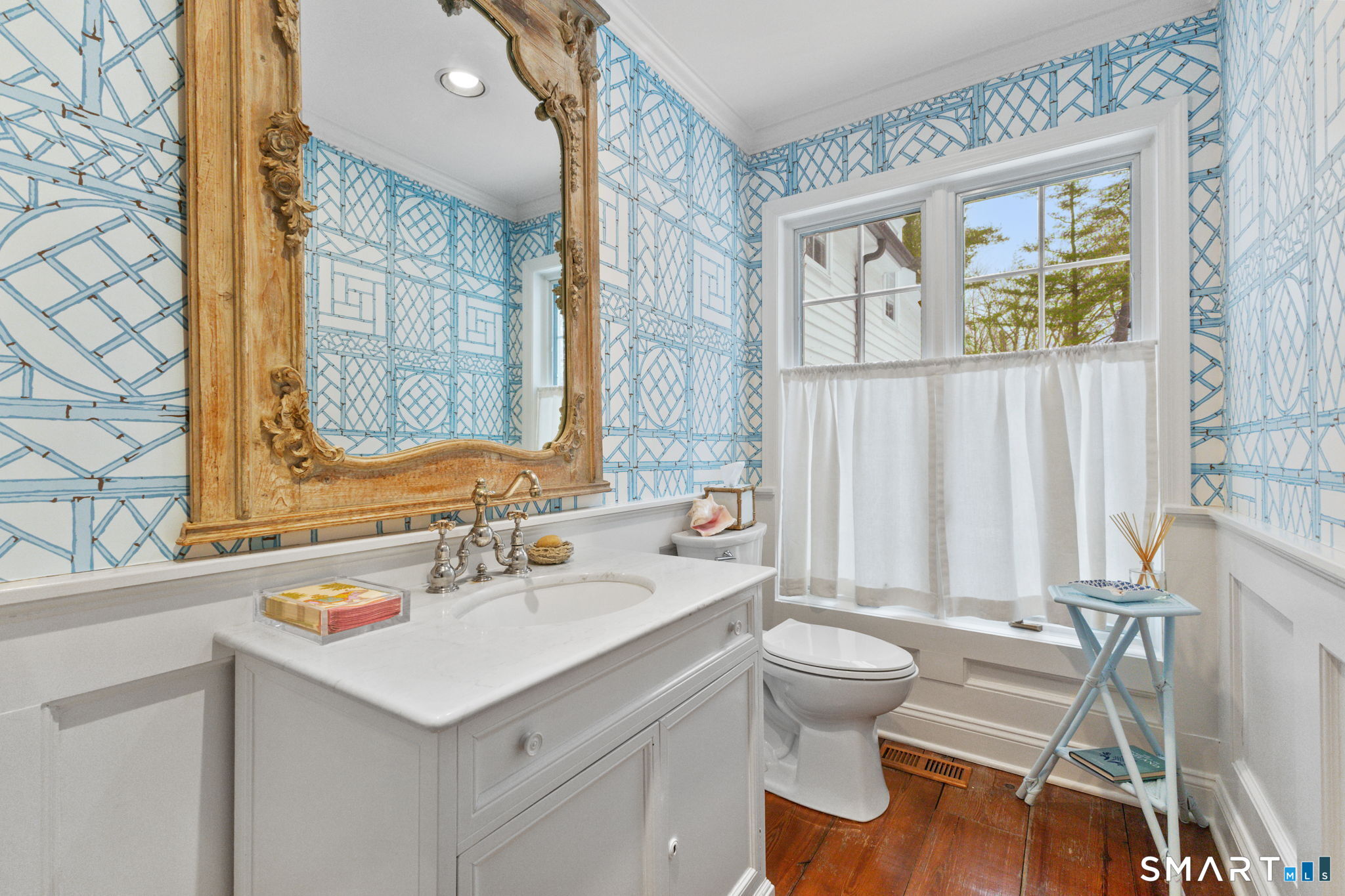 245 Benedict Hill Road New Canaan, CT 06840 - Photo 34 of 49 a bathroom with a sink a toilet and a window