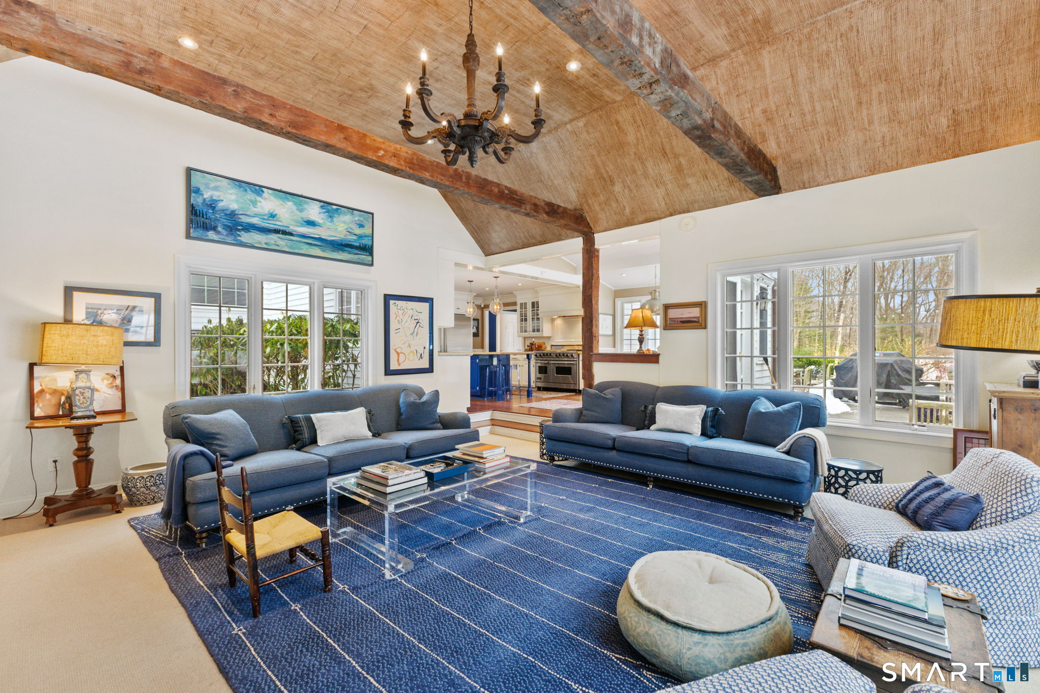 245 Benedict Hill Road New Canaan, CT 06840 - Photo 40 of 49 a living room with furniture a rug and a large window