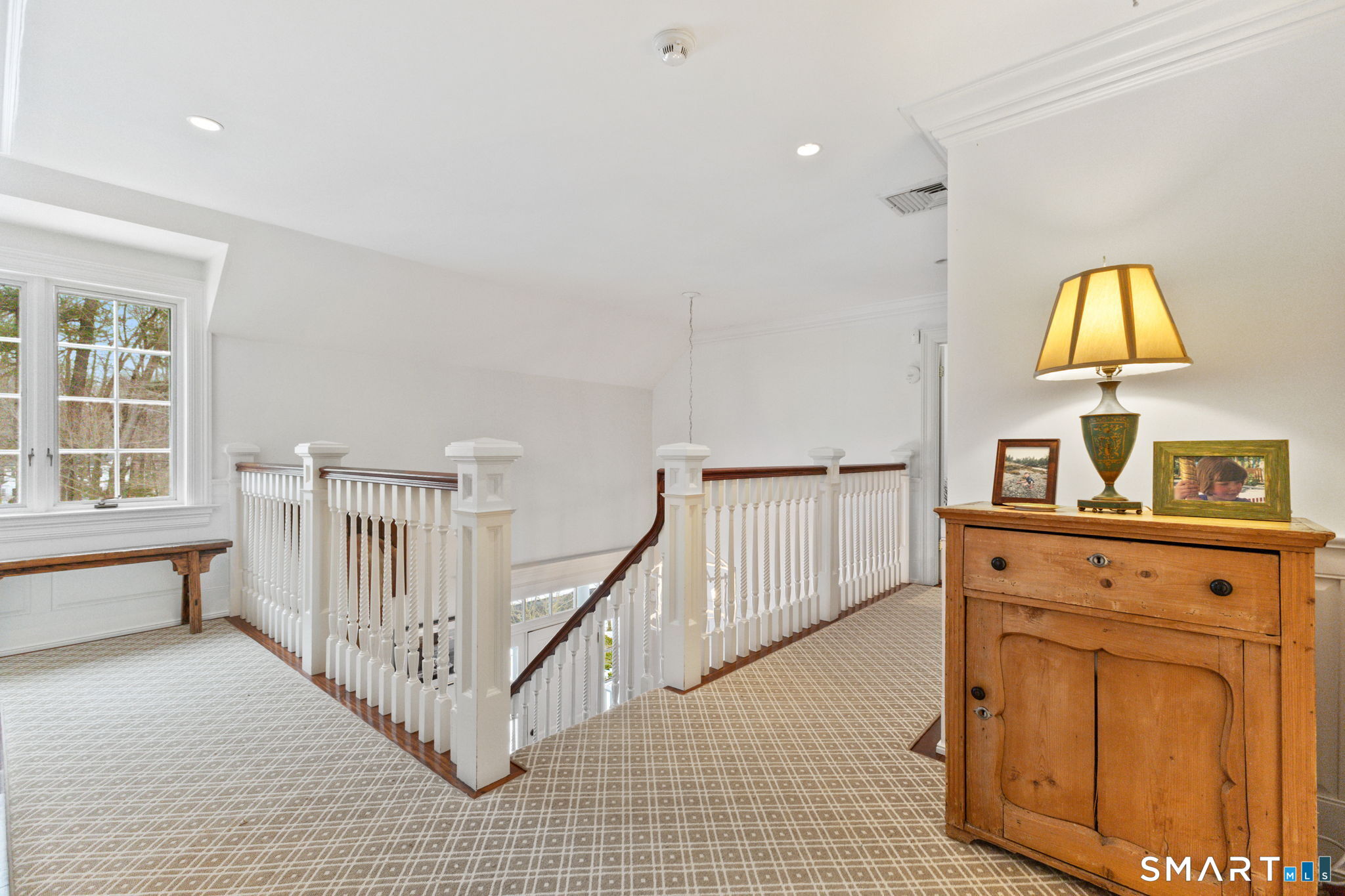 245 Benedict Hill Road New Canaan, CT 06840 - Photo 41 of 49 a view of a bedroom with wooden floor and furniture