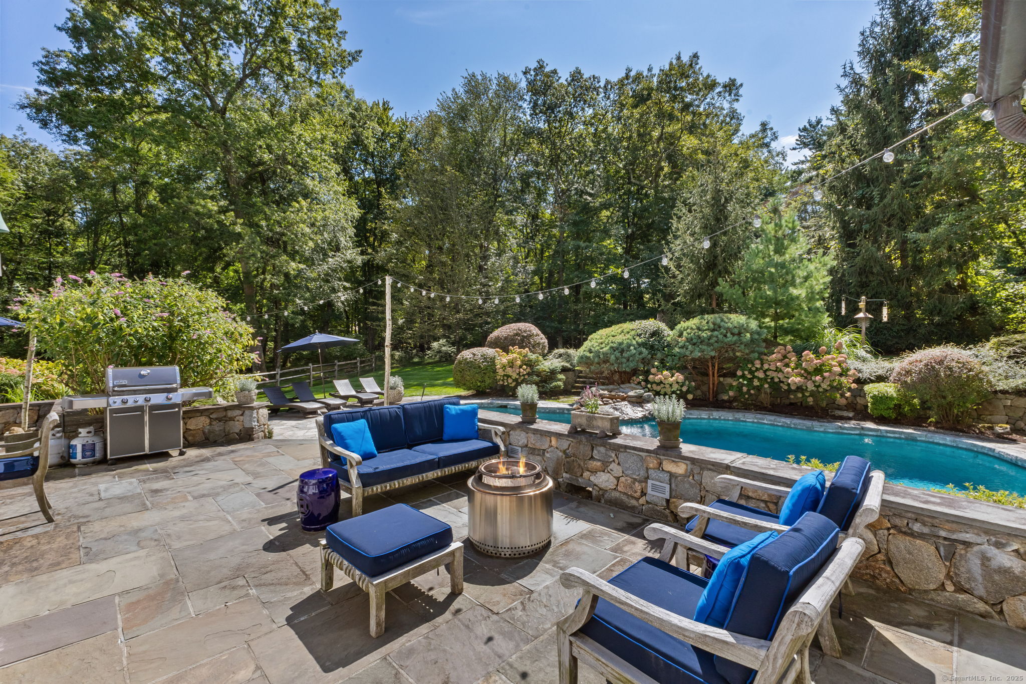 245 Benedict Hill Road New Canaan, CT 06840 - Photo 6 of 49 a view of a patio with couches table and chairs and potted plants