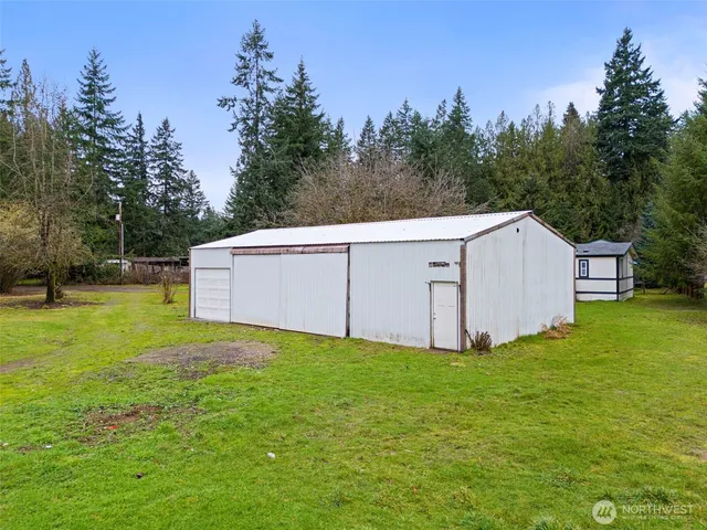 a house with swimming pool in front of it