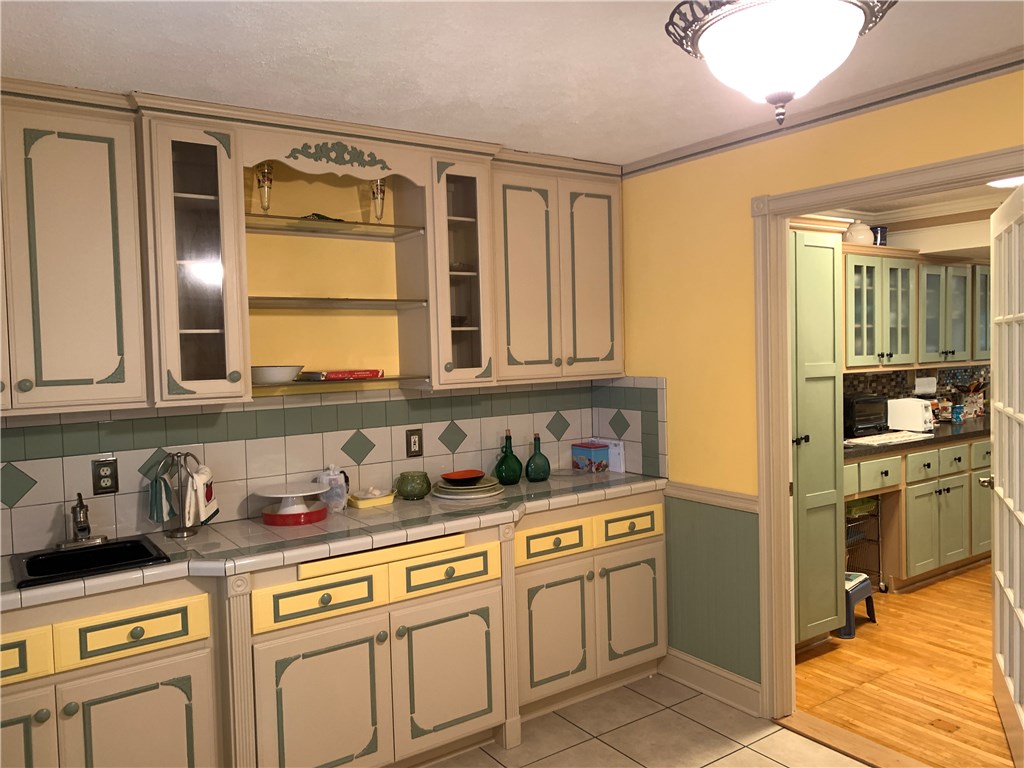 96851 Chester Road Yulee, FL 32097 - Photo 4 of 28 a kitchen with stainless steel appliances granite countertop a sink and cabinets