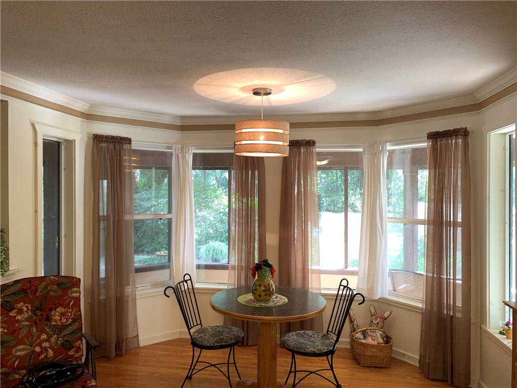 96851 Chester Road Yulee, FL 32097 - Photo 8 of 28 a dining room with furniture and large windows