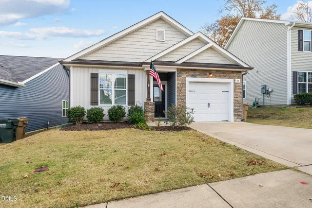 a view of a white house with large windows