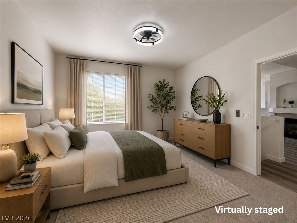 9050 West Warm Springs Road, Unit 2002 Las Vegas, NV 89148 - Photo 20 of 46 Relax in comfort in this tranquil bedroom, offering a serene escape with soft, inviting textures.