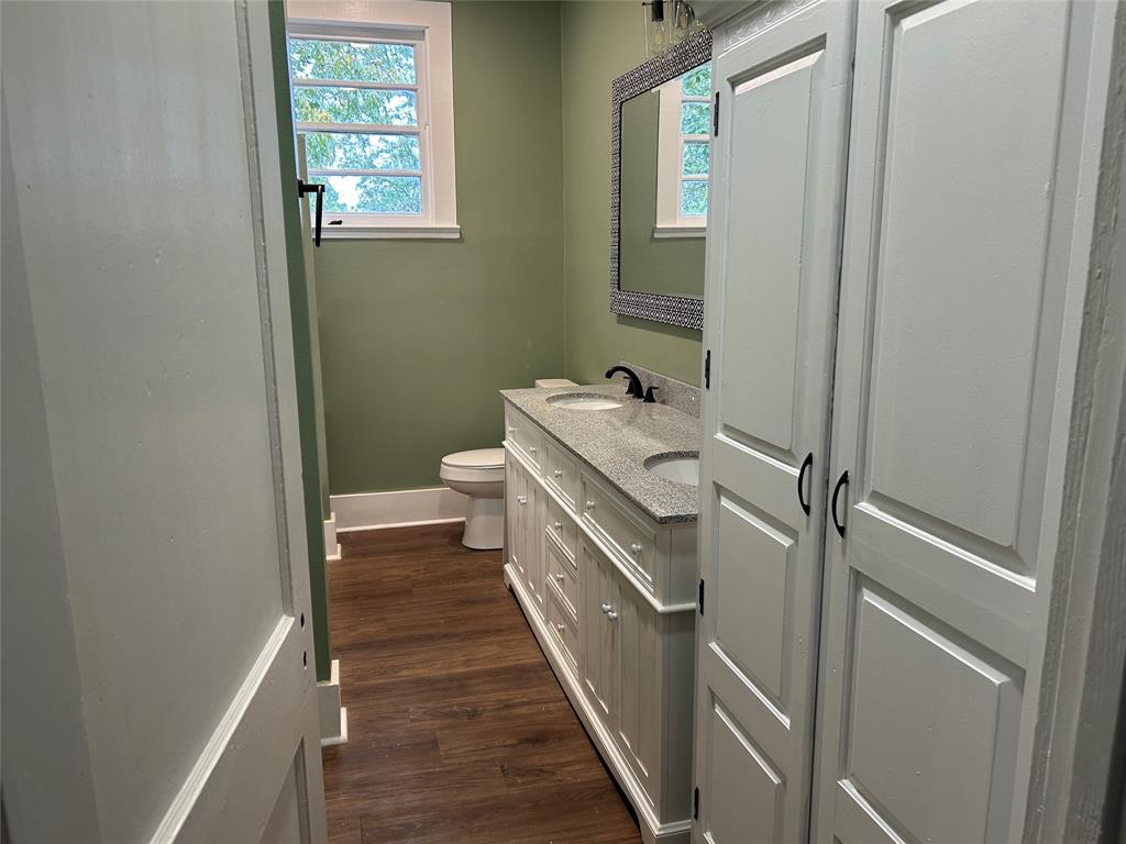 321 Kings Highway Mansfield, LA 71052 - Photo 20 of 22 a bathroom with a sink a toilet and a window