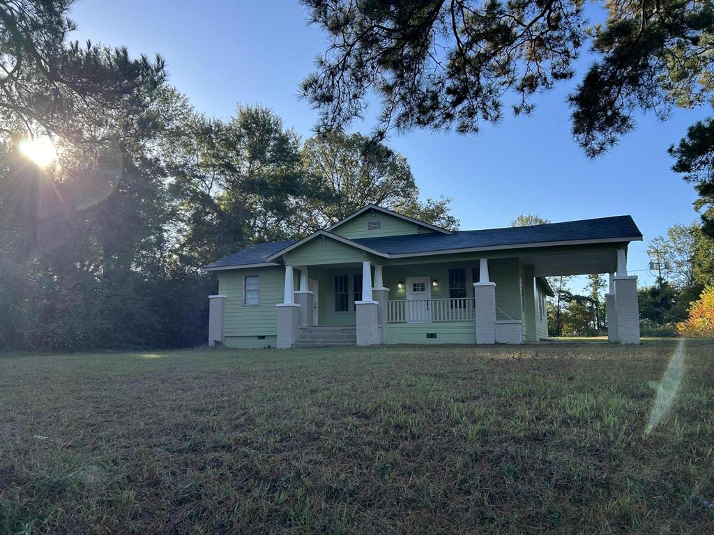 321 Kings Highway Mansfield, LA 71052 - Photo 22 of 22 a front view of a house with yard and trees