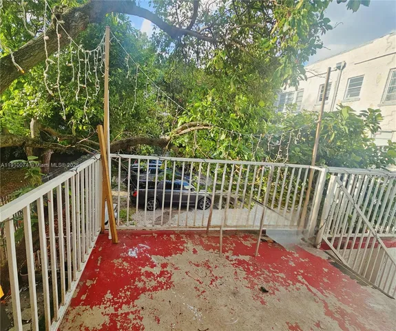 a view of a two chairs in the balcony