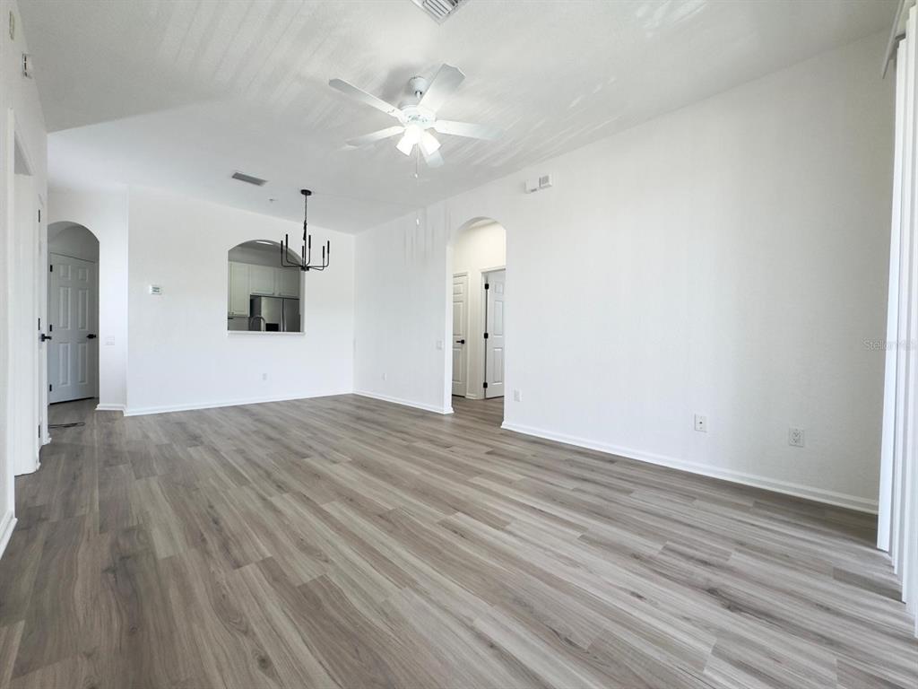 13512 Turtle Marsh Loop, Unit 729 Orlando, FL 32837 - Photo 11 of 42 a view of empty room with wooden floor