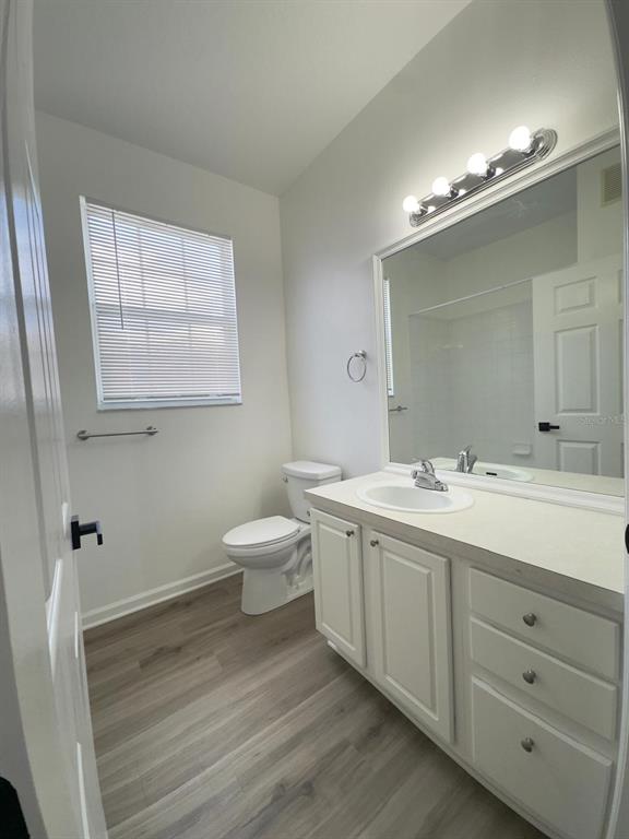 13512 Turtle Marsh Loop, Unit 729 Orlando, FL 32837 - Photo 15 of 42 a bathroom with a double vanity sink and a mirror