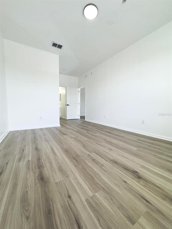 13512 Turtle Marsh Loop, Unit 729 Orlando, FL 32837 - Photo 30 of 42 a view of empty room with wooden floor