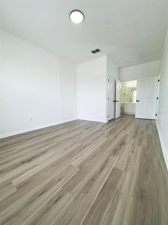 13512 Turtle Marsh Loop, Unit 729 Orlando, FL 32837 - Photo 33 of 42 a view of empty room with wooden floor