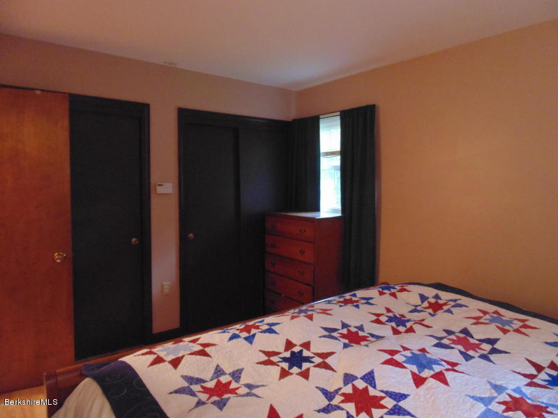 13 August Smith Road Peru, MA 01235 - Photo 13 of 20 a bedroom with a bed and a mirror