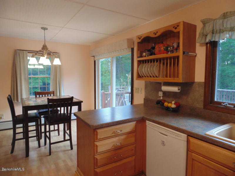 13 August Smith Road Peru, MA 01235 - Photo 4 of 20 a kitchen with a table chairs and a chandelier