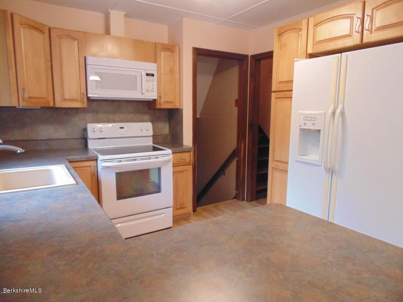 13 August Smith Road Peru, MA 01235 - Photo 7 of 20 a kitchen with stainless steel appliances granite countertop a refrigerator and a stove