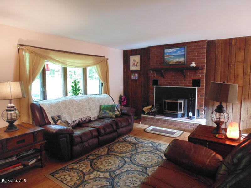 13 August Smith Road Peru, MA 01235 - Photo 8 of 20 a living room with furniture and a fireplace