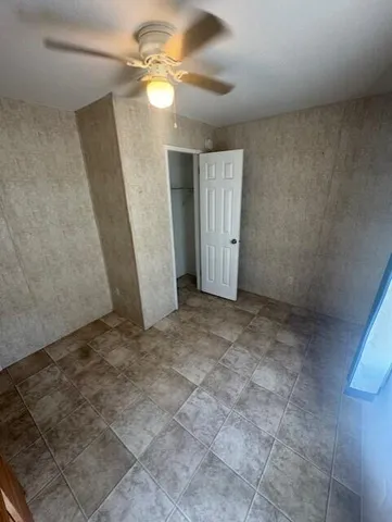 a view of a big room with carpet