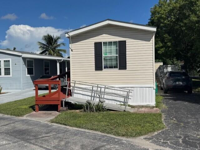 2990 Southwest 53rd Avenue Davie, FL 33314 - Photo 2 of 30 a front view of a house with swing and a garage