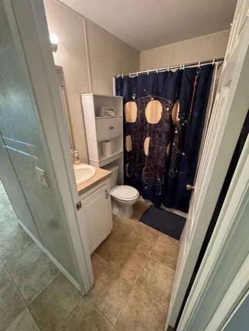 a bathroom with a sink and toilet