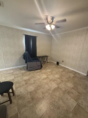 a view of workspace with furniture and chandelier