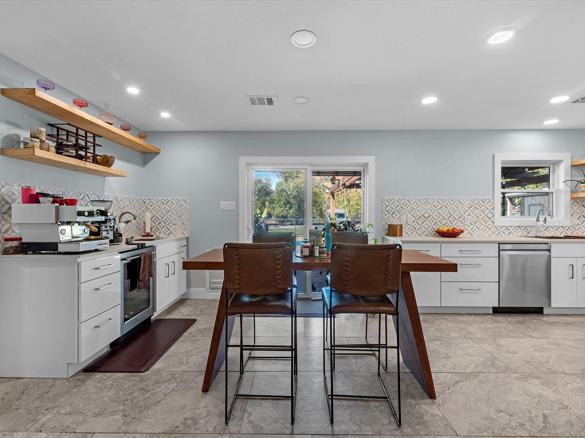 712 Barbara Street Tomball, TX 77375 - Photo 11 of 25 a kitchen that has a lot of cabinets in it and appliances