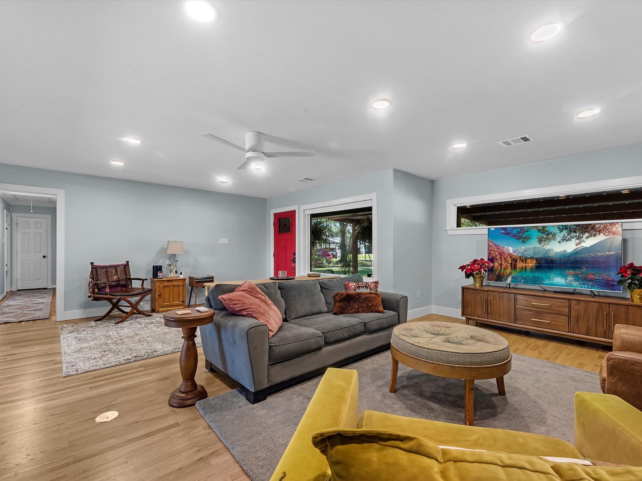 712 Barbara Street Tomball, TX 77375 - Photo 13 of 25 a living room with furniture and a flat screen tv