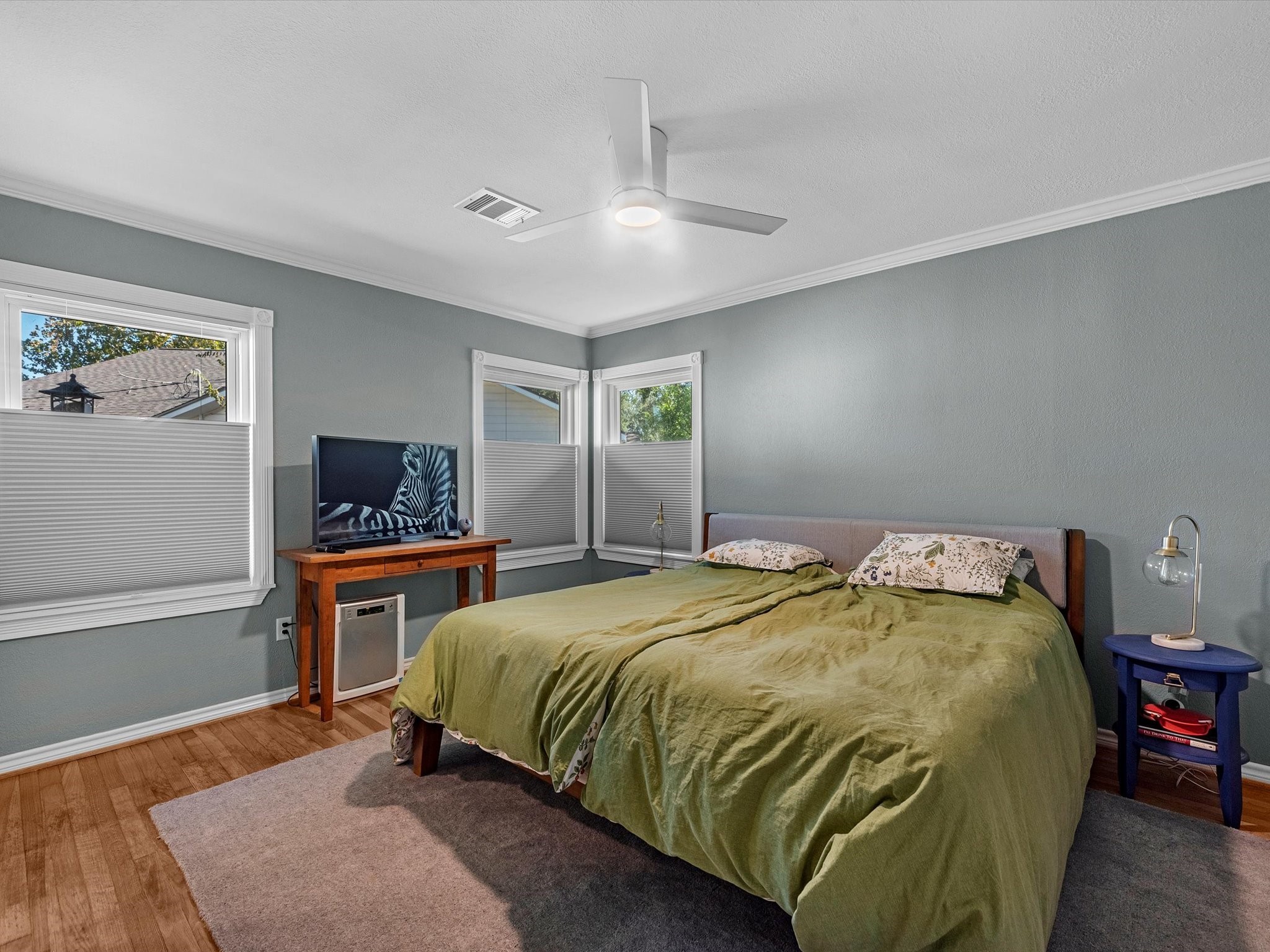 712 Barbara Street Tomball, TX 77375 - Photo 15 of 25 a bedroom with a bed and dresser