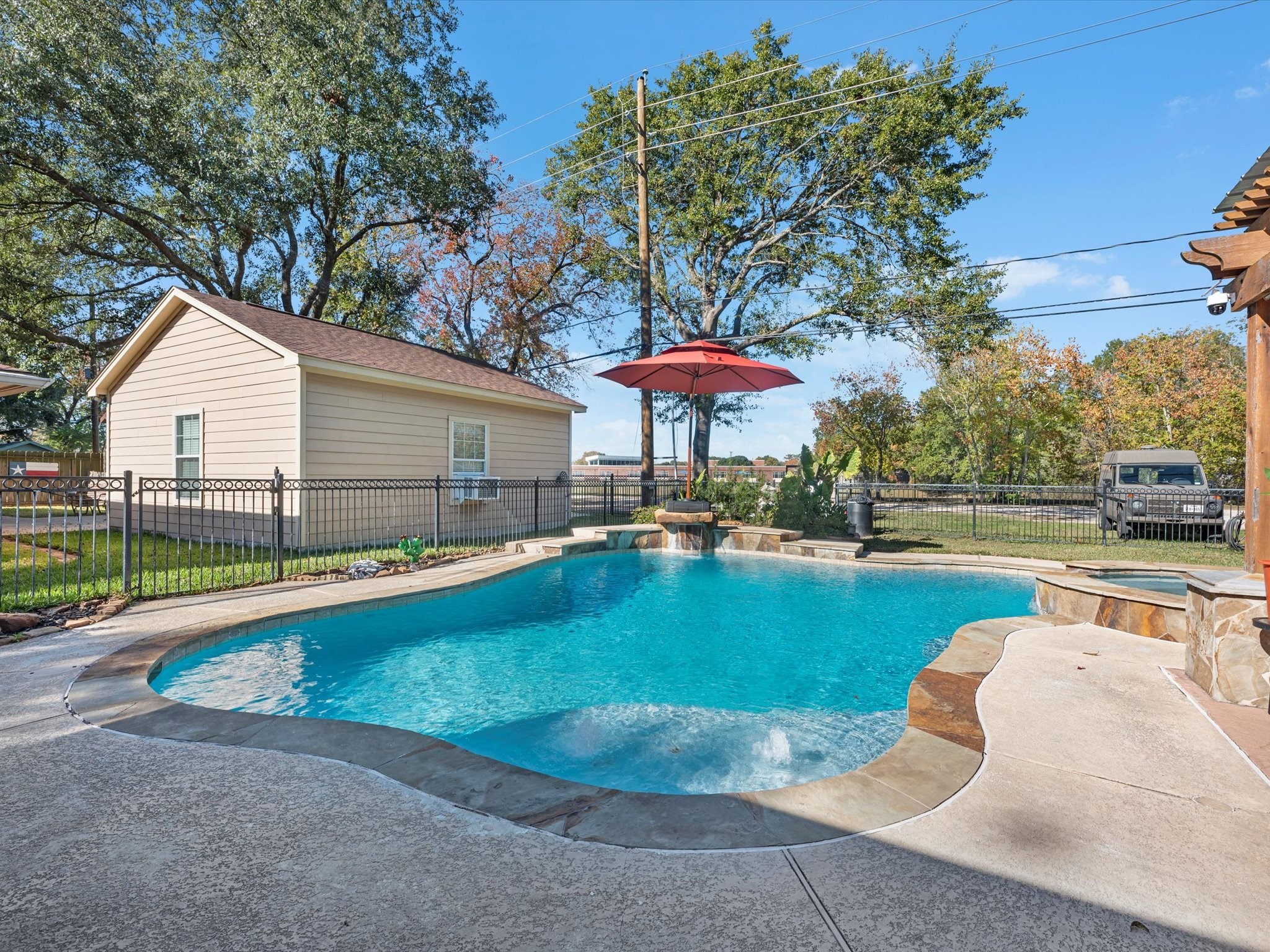 712 Barbara Street Tomball, TX 77375 - Photo 23 of 25 a view of a house with swimming pool and sitting area