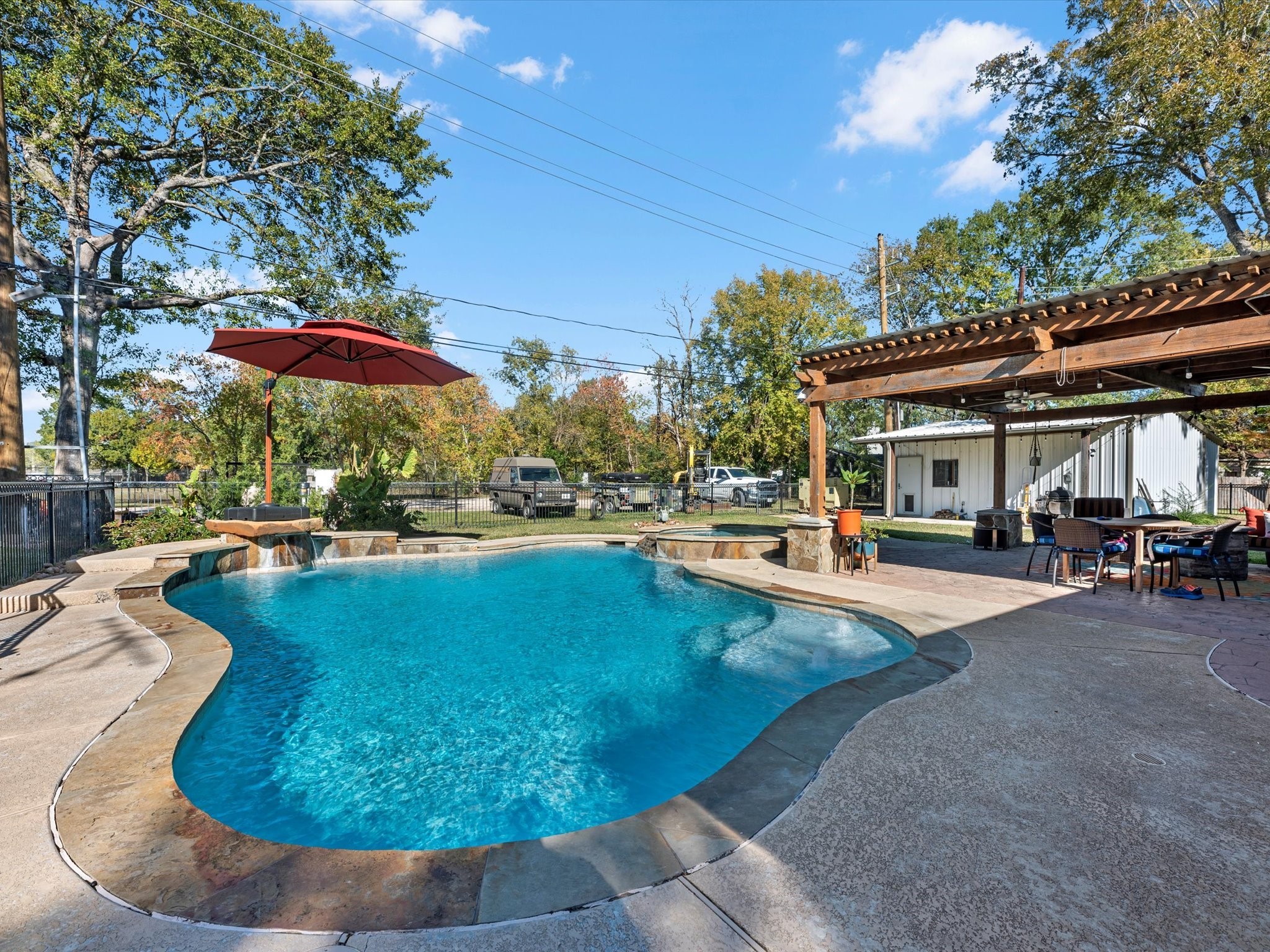 712 Barbara Street Tomball, TX 77375 - Photo 3 of 25 a view of a house with swimming pool and sitting area