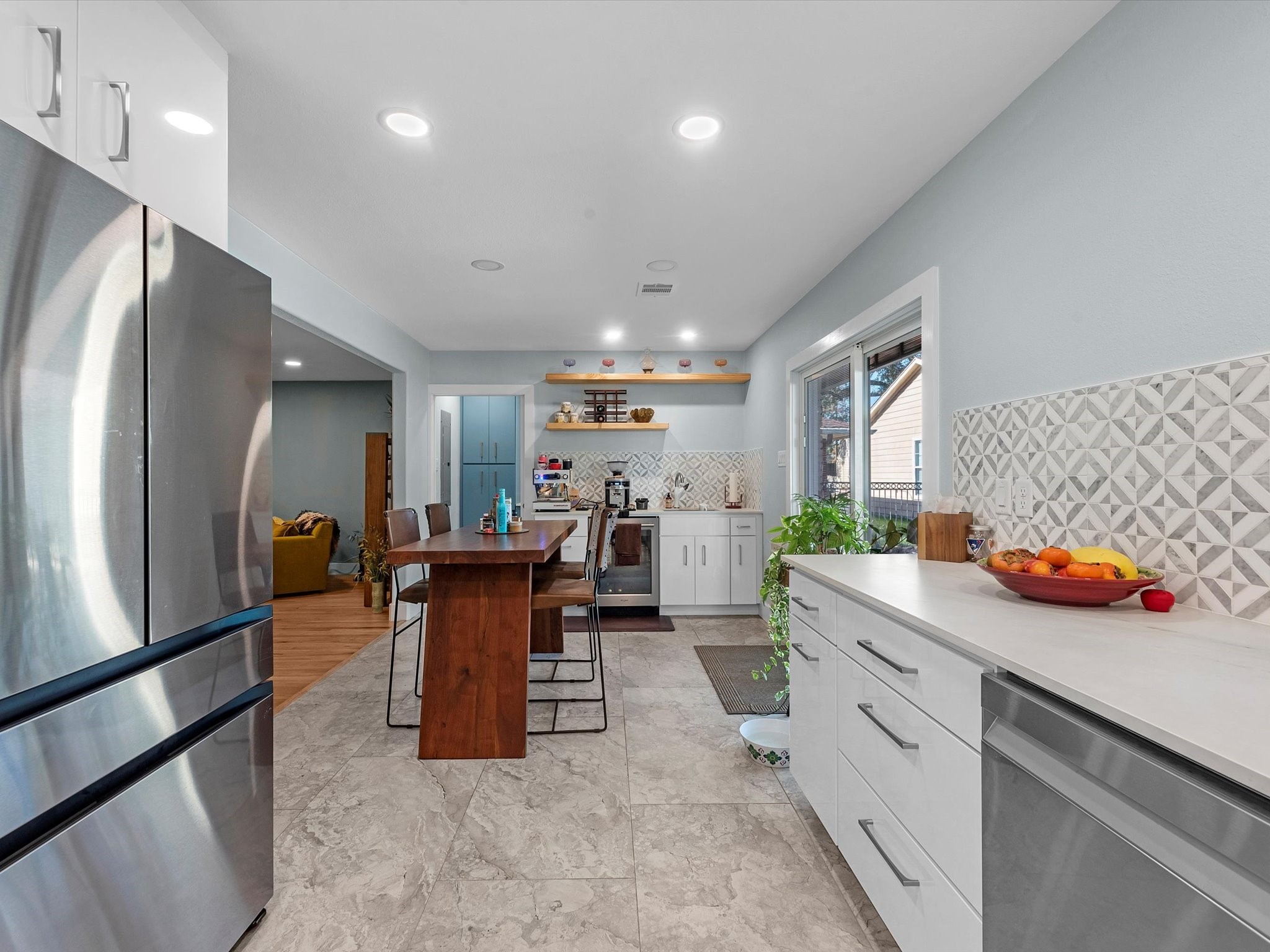 712 Barbara Street Tomball, TX 77375 - Photo 9 of 25 a kitchen with stainless steel appliances granite countertop a sink a stove and a refrigerator