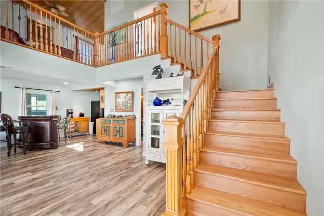 a bedroom with two beds and painting on the wall